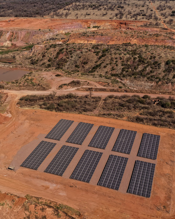 Aerial view of a solar energy installation with rows of photovoltaic panels providing renewable electricity to mining operations in a remote landscape in Rustenburg North West South Africa. Aerial view of a solar energy installation with rows of photovoltaic panels providing renewable electricity to mining operations in a remote landscape in Rustenburg North West South Africa.