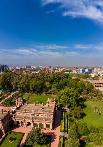 Aerial view of Islamia College University Peshawar with its historic architecture lush gardens and surrounding urban landscape in Peshawar Khyber Pakhtunkhwa Pakistan. Aerial view of Islamia College University Peshawar with its historic architecture lush gardens and surrounding urban landscape in Peshawar Khyber Pakhtunkhwa Pakistan.