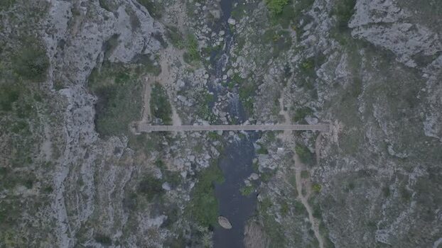 Aerial view of Tibetan bridge in Gravina canyon Italy.