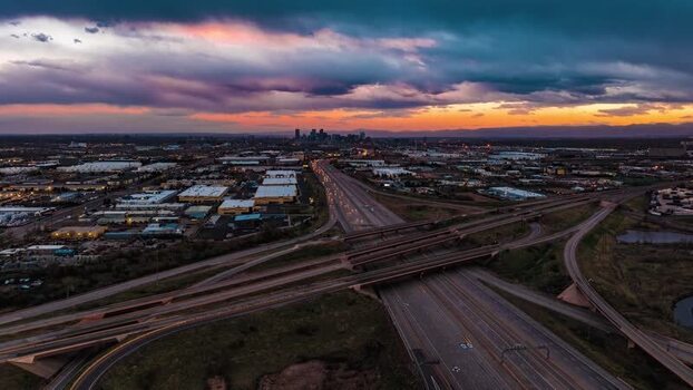 Aerial view of highway interchange and Denver skyline United States.