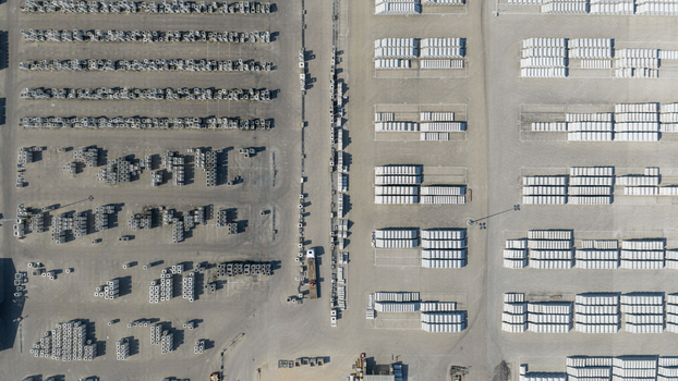Aerial view of an industrial storage yard with neatly organized rows of stacked concrete blocks and construction materials in Oosterhout North Brabant Netherlands. Aerial view of an industrial storage yard with neatly organized rows of stacked concrete blocks and construction materials in Oosterhout North Brabant Netherlands.
