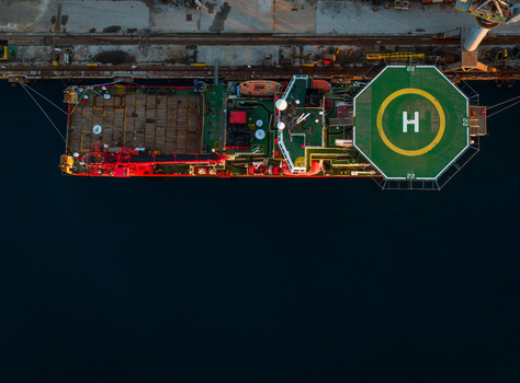 Aerial view of a ship with a helipad docked at the Uljanik Shipyard in Pula Croatia. Aerial view of a ship with a helipad docked at the Uljanik Shipyard in Pula Croatia.