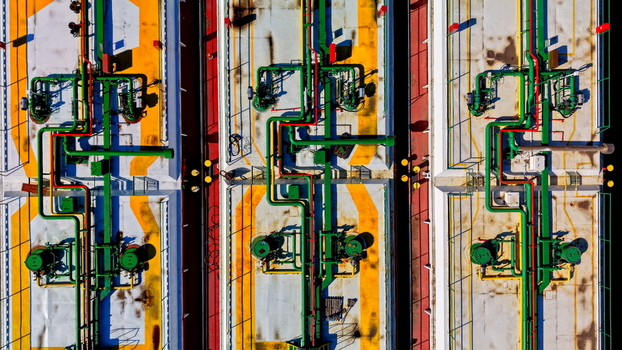 Aerial view of industrial piping systems and storage tanks at a shipyard facility in Smederevo Podunavlje District Serbia.