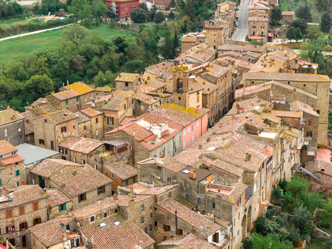 Aerial view of the historic stone houses and medieval tower nestled in the green hills of Ficulle Umbria Italy. Aerial view of the historic stone houses and medieval tower nestled in the green hills of Ficulle Umbria Italy.