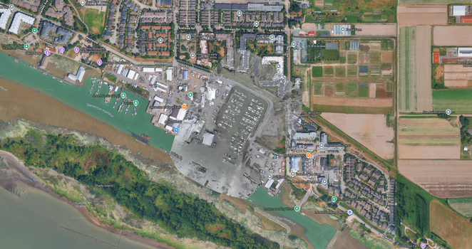 Aerial view of Steveston Harbour featuring boats docked at the marina surrounding residential buildings and agricultural fields in Richmond British Columbia Canada. Aerial view of Steveston Harbour featuring boats docked at the marina surrounding residential buildings and agricultural fields in Richmond British Columbia Canada.
