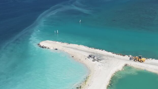 Aerial view of a sand breakwater construction Maldives.