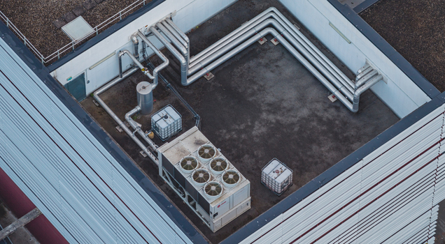Aerial view of rooftop mechanical ventilation system with industrial air ducts HVAC units and cooling infrastructure on a facility in Valence Auvergne Rhone Alpes France.
