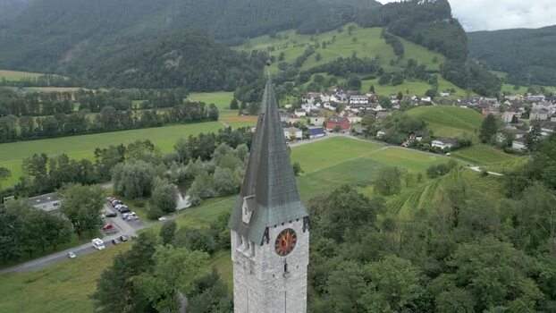 Aerial view of church tower in green landscape Liechtenstein.