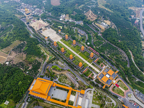 Aerial view of Fo Guang Shan Buddha Museum with its grand pagodas expansive courtyards and lush surrounding hills in Jiuru Township Pingtung County Taiwan. Aerial view of Fo Guang Shan Buddha Museum with its grand pagodas expansive courtyards and lush surrounding hills in Jiuru Township Pingtung County Taiwan.