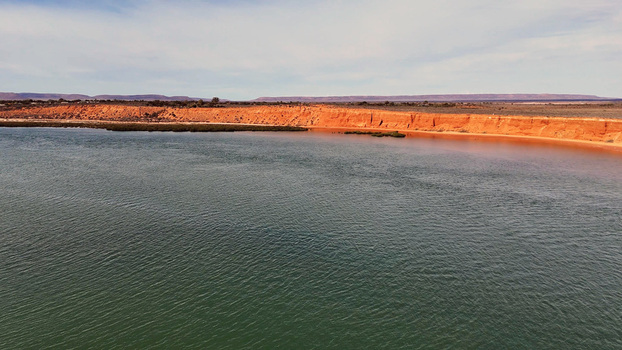 Aerial view of Matthew Flinders Red Cliff Lookout with its distinctive red sandstone cliffs along the Spencer Gulf in Port Augusta West South Australia Australia. Aerial view of Matthew Flinders Red Cliff Lookout with its distinctive red sandstone cliffs along the Spencer Gulf in Port Augusta West South Australia Australia.