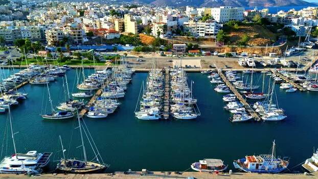 Aerial view of marina with sailboats and yachts in Crete Greece.
