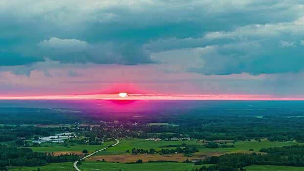 Aerial view of sunset over the green landscape of Latvia. Aerial view of sunset over the green landscape of Latvia.