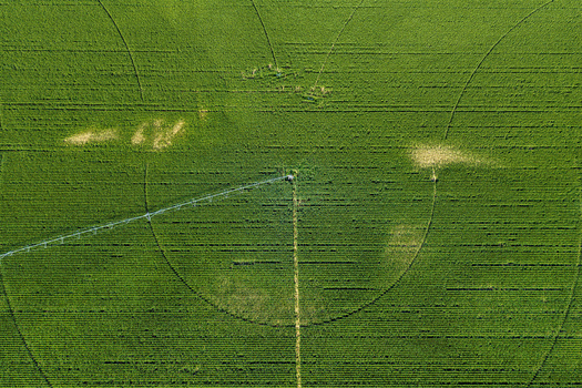 Aerial view of a circular irrigation system in a lush green agricultural field in Hombourg Grand Est France. Aerial view of a circular irrigation system in a lush green agricultural field in Hombourg Grand Est France.