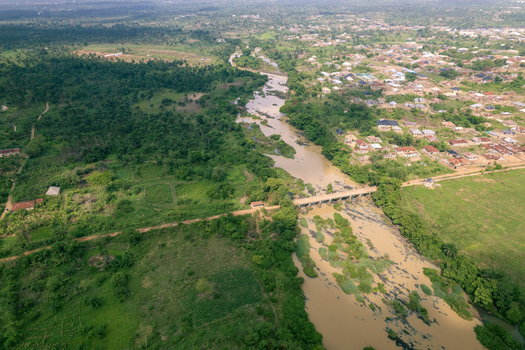 Aerial view of the Asejire Dam its concrete structure stark against the muddy water and vibrant green vegetation Asejire Oyo Nigeria. Aerial view of the Asejire Dam its concrete structure stark against the muddy water and vibrant green vegetation Asejire Oyo Nigeria.