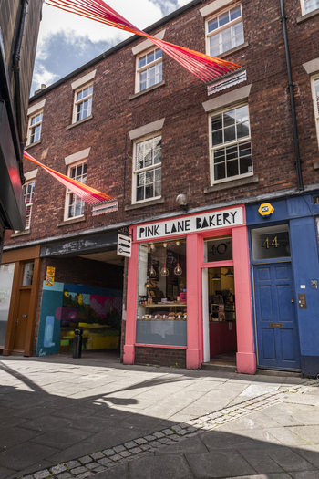 Newcastle upon Tyne United Kingdom 13 July 2026 View of Pink Lane Bakery with its distinctive pink facade and brick building exterior on a sunny day. Newcastle upon Tyne United Kingdom 13 July 2026 View of Pink Lane Bakery with its distinctive pink facade and brick building exterior on a sunny day.