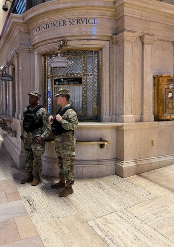 New York United States 14 May 2026 View of two soldiers in camouflage uniforms standing by a customer service booth inside the historic Grand Central Terminal.