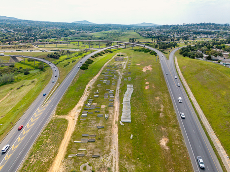 Aerial view of the highway interchange in Brackenfell with cars driving on asphalt roads surrounded by grassy embankments and suburban landscape in Cape Town Western Cape South Africa. Aerial view of the highway interchange in Brackenfell with cars driving on asphalt roads surrounded by grassy embankments and suburban landscape in Cape Town Western Cape South Africa.
