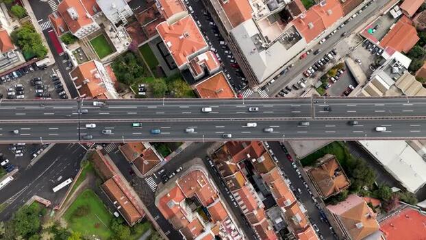 Aerial view of cars driving on a bridge over Alcantara Portugal.
