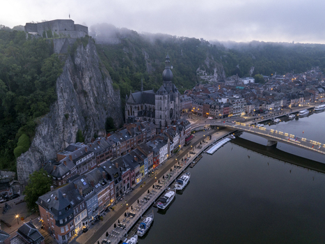 Aerial view of the Collegiate Church of Notre Dame de Dinant and the Citadel of Dinant overlooking the Meuse River in Dinant Wallonia Belgium. Aerial view of the Collegiate Church of Notre Dame de Dinant and the Citadel of Dinant overlooking the Meuse River in Dinant Wallonia Belgium.