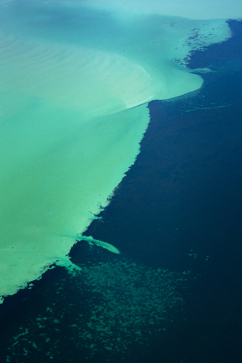 Aerial view of turquoise ocean patterns and deep blue water currents Shire of Shark Bay Western Australia Australia. Aerial view of turquoise ocean patterns and deep blue water currents Shire of Shark Bay Western Australia Australia.