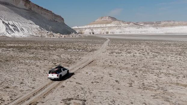 Aerial view of an off road vehicle in Tuzbair Kazakhstan. Aerial view of an off road vehicle in Tuzbair Kazakhstan.