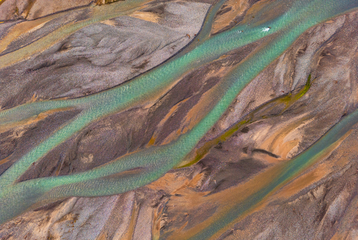 Aerial view of the turquoise glacial river channels of Kol Suu flowing through the gravel and silt landscape of the At Bashi District Naryn Region Kyrgyzstan. Aerial view of the turquoise glacial river channels of Kol Suu flowing through the gravel and silt landscape of the At Bashi District Naryn Region Kyrgyzstan.