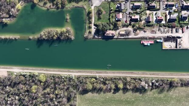 Aerial view of canal with boats and houses France.