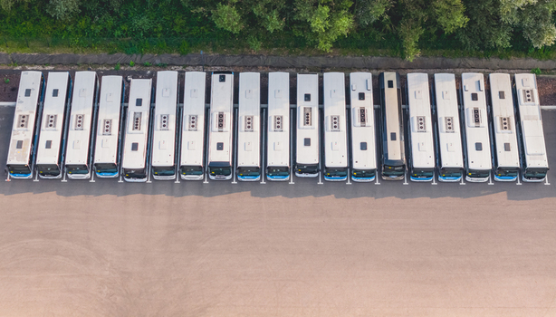 Loriol sur Drome France 26 July 2026 Aerial view of a fleet of modern public transport buses parked in parallel at a depot showcasing urban mobility and infrastructure.