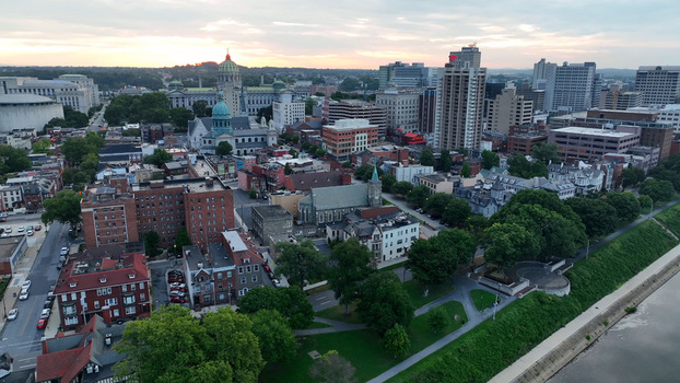 Aerial view of the Harrisburg skyline featuring the Pennsylvania State Capitol dome historic cathedrals and urban architecture in Harrisburg Pennsylvania United States.