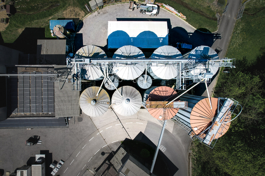 Aerial view of the Moulin de la Vaux industrial silos and solar panels in Aubonne Vaud Switzerland. Aerial view of the Moulin de la Vaux industrial silos and solar panels in Aubonne Vaud Switzerland.