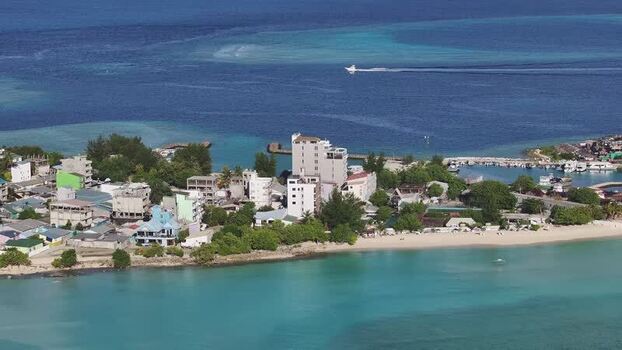 Aerial view of Gulhi island with turquoise waters and buildings Maldives. Aerial view of Gulhi island with turquoise waters and buildings Maldives.