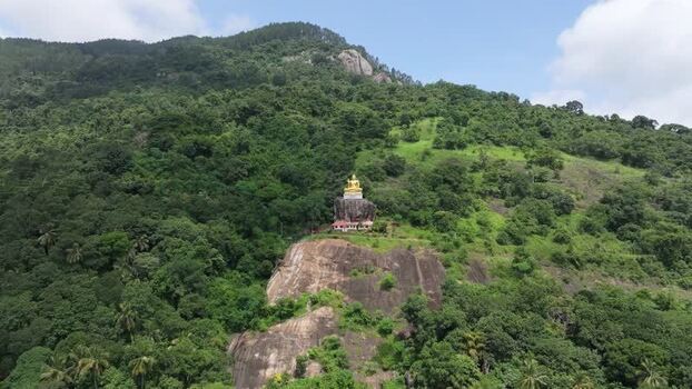 Aerial view of Buddha statue on hillside in Kandy Sri Lanka.