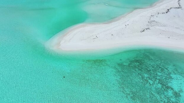 Aerial view of a white sandbank and turquoise lagoon in Maldives. Aerial view of a white sandbank and turquoise lagoon in Maldives.