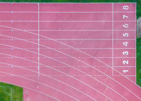 Aerial view of the Sports and Recreation Center running track with numbered lanes in Starogard Gdanski Pomeranian Voivodeship Poland. Aerial view of the Sports and Recreation Center running track with numbered lanes in Starogard Gdanski Pomeranian Voivodeship Poland.