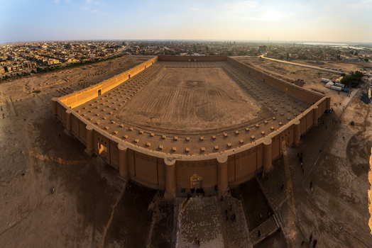 Aerial view of the Great Mosque of Samarra featuring its massive outer walls and bastions overlooking the urban landscape Samarra Saladin Governorate Iraq.