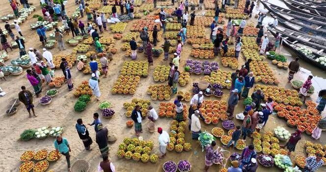 Aerial view of a busy vegetable market with people Bangladesh.