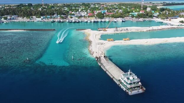 Aerial view of a harbor with boats and construction Maldives. Aerial view of a harbor with boats and construction Maldives.
