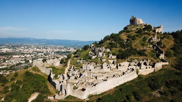 Aerial view of the medieval ruins of Chateau de Crussol on a limestone ridge overlooking the Rhone valley in Saint Peray Auvergne Rhone Alpes France.