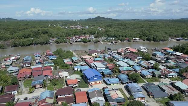 Aerial view of a riverine village in Sarawak Malaysia. Aerial view of a riverine village in Sarawak Malaysia.