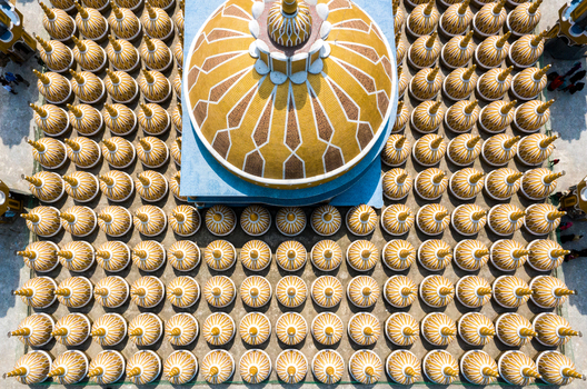 Aerial view of a grand mosque s golden central dome amidst hundreds of shimmering cupolas Tangail Dhaka Division Bangladesh. Aerial view of a grand mosque s golden central dome amidst hundreds of shimmering cupolas Tangail Dhaka Division Bangladesh.