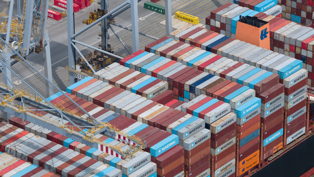 Corringham England United Kingdom 10 July 2026 Aerial view of Solent Stevedores London Gateway with stacked Maersk shipping containers and industrial cranes at the cargo terminal.