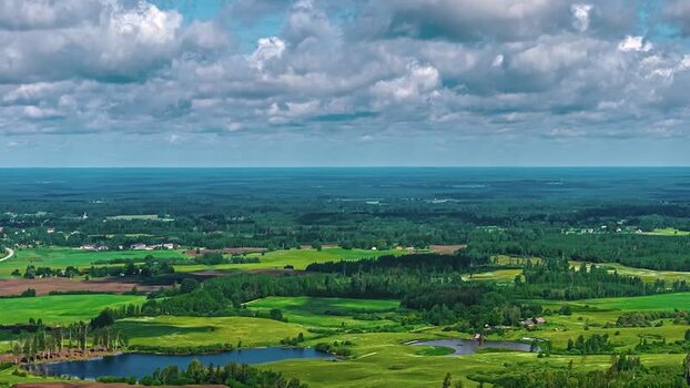 Aerial view of rural landscape with green fields and lake Latvia. Aerial view of rural landscape with green fields and lake Latvia.