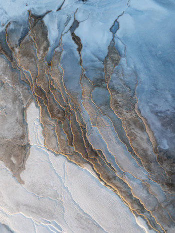 Aerial view of Reykjanes volcanic landscape featuring intricate geothermal patterns and rugged lava textures in Grindavikurbaer Iceland. Aerial view of Reykjanes volcanic landscape featuring intricate geothermal patterns and rugged lava textures in Grindavikurbaer Iceland.