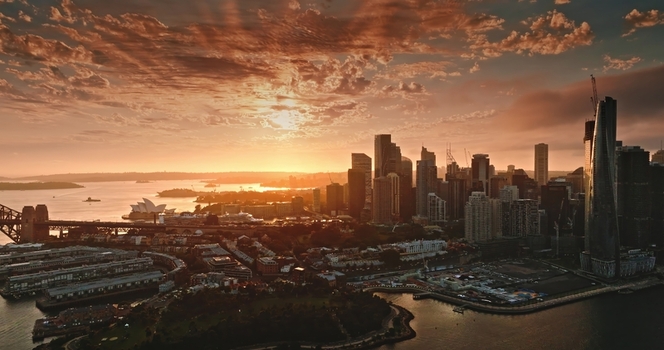 Aerial view of the Sydney Opera House and the Sydney Harbour Bridge at sunset with the city skyline illuminated by golden light in Sydney New South Wales Australia. Aerial view of the Sydney Opera House and the Sydney Harbour Bridge at sunset with the city skyline illuminated by golden light in Sydney New South Wales Australia.