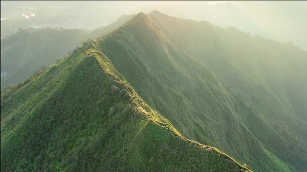 Aerial view of the lush green mountain ridges of Dieng Indonesia.