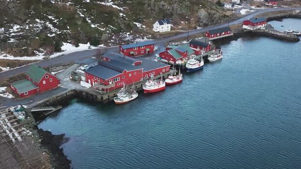 Aerial view of red buildings in Ballstad Norway.