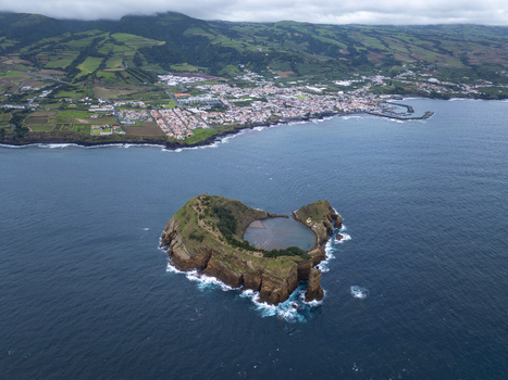 Aerial view of Ilheu de Vila Franca do Campo a volcanic islet with a natural crater lake surrounded by the Atlantic Ocean near the coast of Sao Pedro Acores Portugal. Aerial view of Ilheu de Vila Franca do Campo a volcanic islet with a natural crater lake surrounded by the Atlantic Ocean near the coast of Sao Pedro Acores Portugal.