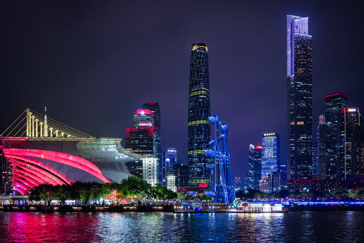 Guangzhou China 22 February 2024 View of the illuminated Guangzhou skyline at night featuring the modern architecture of the opera house and skyscrapers reflecting on the Pearl River. Guangzhou China 22 February 2024 View of the illuminated Guangzhou skyline at night featuring the modern architecture of the opera house and skyscrapers reflecting on the Pearl River.