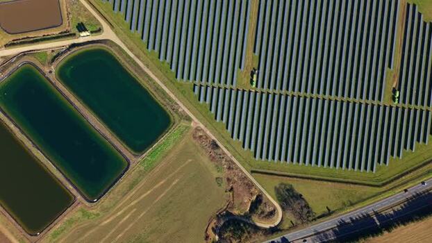 Aerial view of solar panels and ponds United Kingdom.