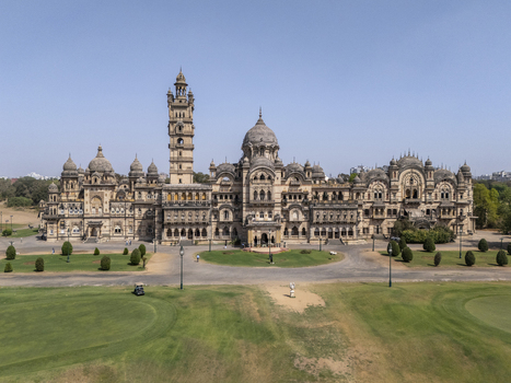 Vadodara India 14 March 2026 Aerial view of Laxmi Vilas Palace featuring its grand Indo Saracenic architecture ornate domes and tall clock tower set against a clear blue sky and lush green lawns. Vadodara India 14 March 2026 Aerial view of Laxmi Vilas Palace featuring its grand Indo Saracenic architecture ornate domes and tall clock tower set against a clear blue sky and lush green lawns.